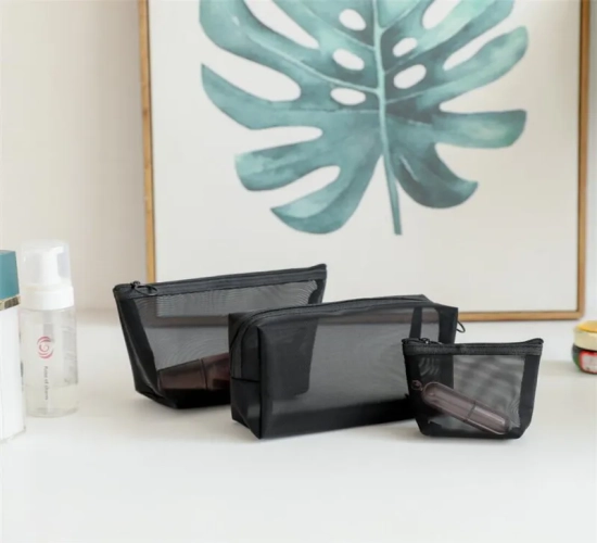 One essential black cosmetic bag, transparent and stylish for both women and men. Ideal for travel, available in small and large sizes for toiletries and makeup.