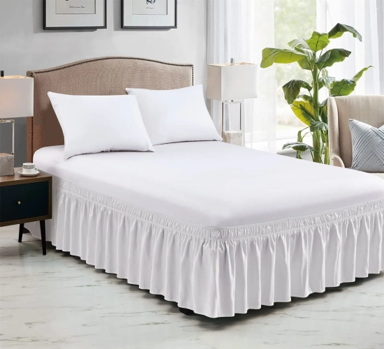 Soft, elastic bed skirt wraps around, fade-resistant, and doubles as a bed protector without a visible surface. Named "Couvre Lit Bed Protector."