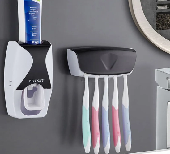 2-piece set: Wall-mounted automatic toothpaste dispenser with dust-proof toothbrush holder and squeezer for bathroom convenience.