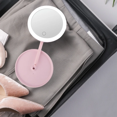 Illuminate your beauty routine with an LED cosmetic mirror. It's dimmable, rotating, and has memory functions, powered by USB for added convenience.
