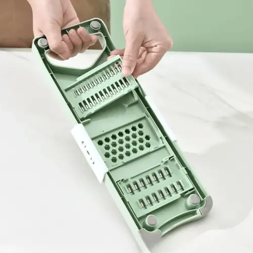 6-in-1 Stainless Steel Multifunctional Manual Vegetable Slicer Cutter: Safe Kitchen Tool for Shredding Potatoes, Garlic, Carrots, and Grating. A versatile chopper for efficient food preparation.