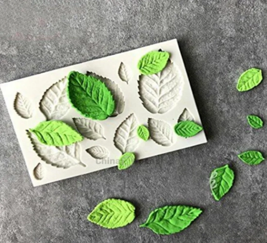 Silicone mold for tree and maple leaf-shaped fondant cake decorating. Versatile baking tool for creating 3D chocolate, sugarcraft, resin clay, and homemade bakeware.