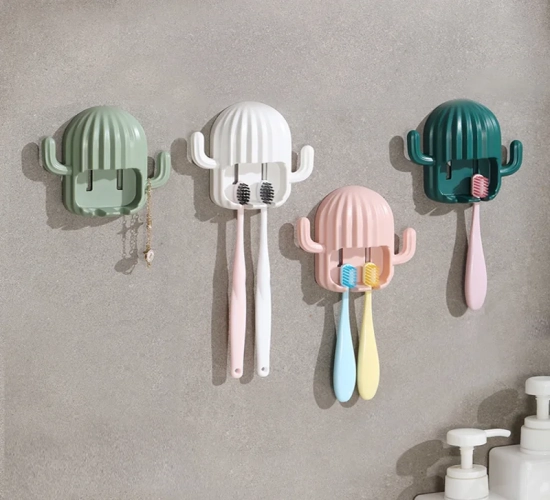 Cactus-themed wall-mounted organizer with self-adhesive rack for toothpaste, hooks, and drainage. Ideal for bathroom storage and electric toothbrushes.