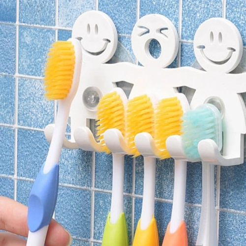 Cute cartoon smile toothbrush holder with wall-mounted suction cup, 5 positions—perfect for bathroom accessories.