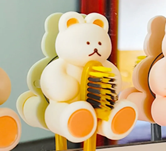 Adorable cartoon bear silicone toothbrush holder with wall-mounted suction cup, storage rack, and hooks - perfect for bathroom accessories.