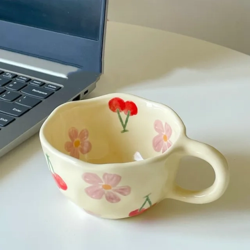 Hand-pinched ceramic mugs in irregular flower design, perfect for coffee, tea, milk, or oatmeal. Korean-style drinkware for breakfast in the kitchen.
