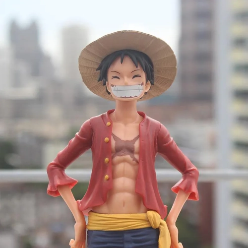 "Captivating 27cm Anime One Piece Figurine: Ros Luffy PVC Statue - Action Figure Depicting the Classic Smiley Monkey D. Luffy Model. A Perfect Toy for Kids and an Ideal Christmas Gift."