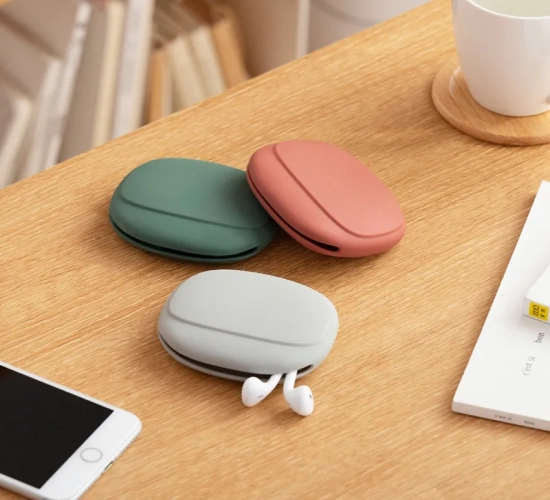 Compact silicone storage bag for portable data cables and headphones, doubles as a cute coin purse. Perfect for home or travel, a great small gift.