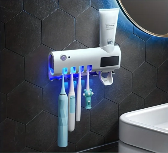 Induction toothbrush holder with automatic toothpaste squeezing, wall-mounted, and hole-free design for multifunctional toothbrush storage.