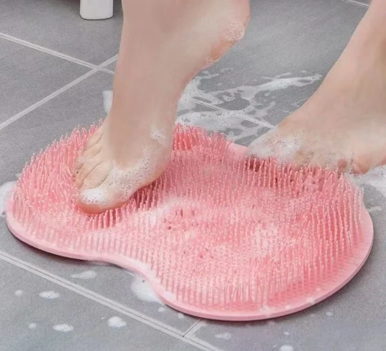 Non-slip silicone shower mat with foot exfoliating and massaging features. Includes a back brush with a sucker for convenient use in the bathroom.