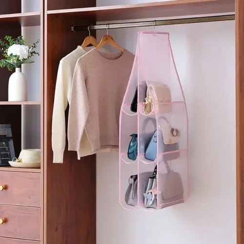 Hanging bag storage for handbags in the bedroom wardrobe. Multi-layer, folding, and dustproof design for organized closet storage.