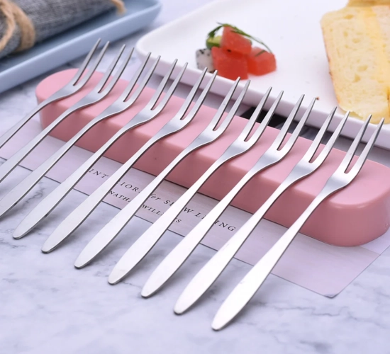 Set of 10 lovely mini stainless steel fruit forks for desserts. Perfect for snacks, cakes, and use at home or in cafeterias.